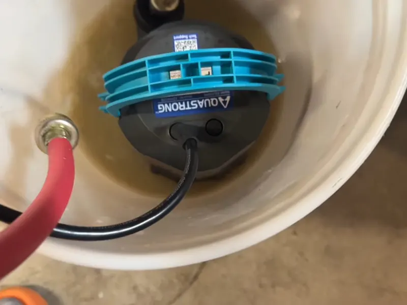 Under sink disposal wiring and drain connections are checked below the kitchen basin near Cerritos, CA on Garbage Disposal Repair & Installation in Cerritos, CA body gdr 002